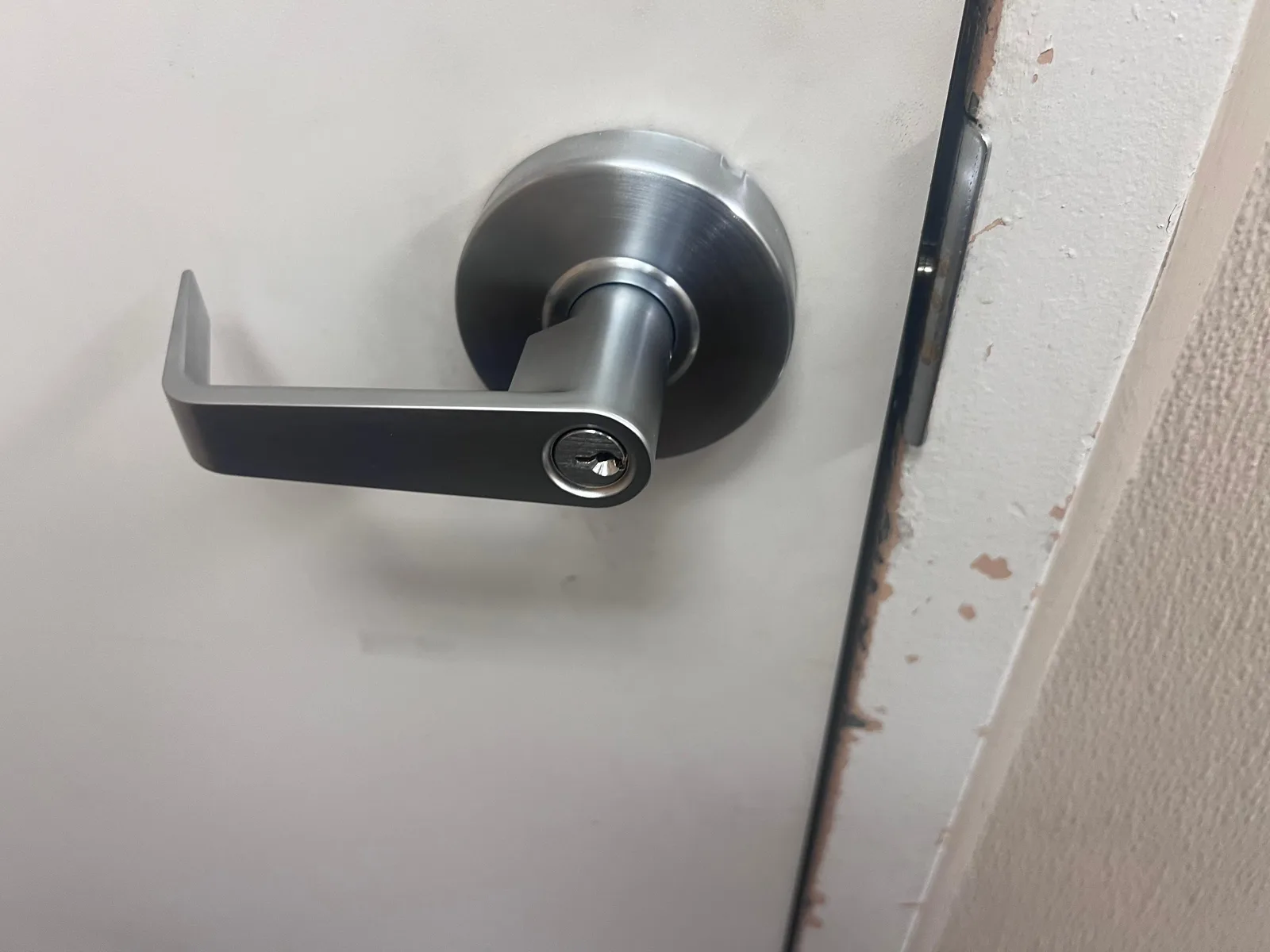 Commercial door lever handle installation for ADA compliance