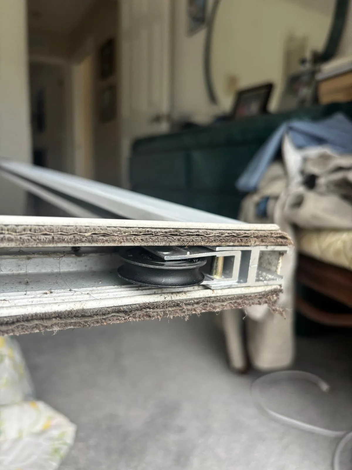 Worn roller pulled from a Vero Beach sliding door
