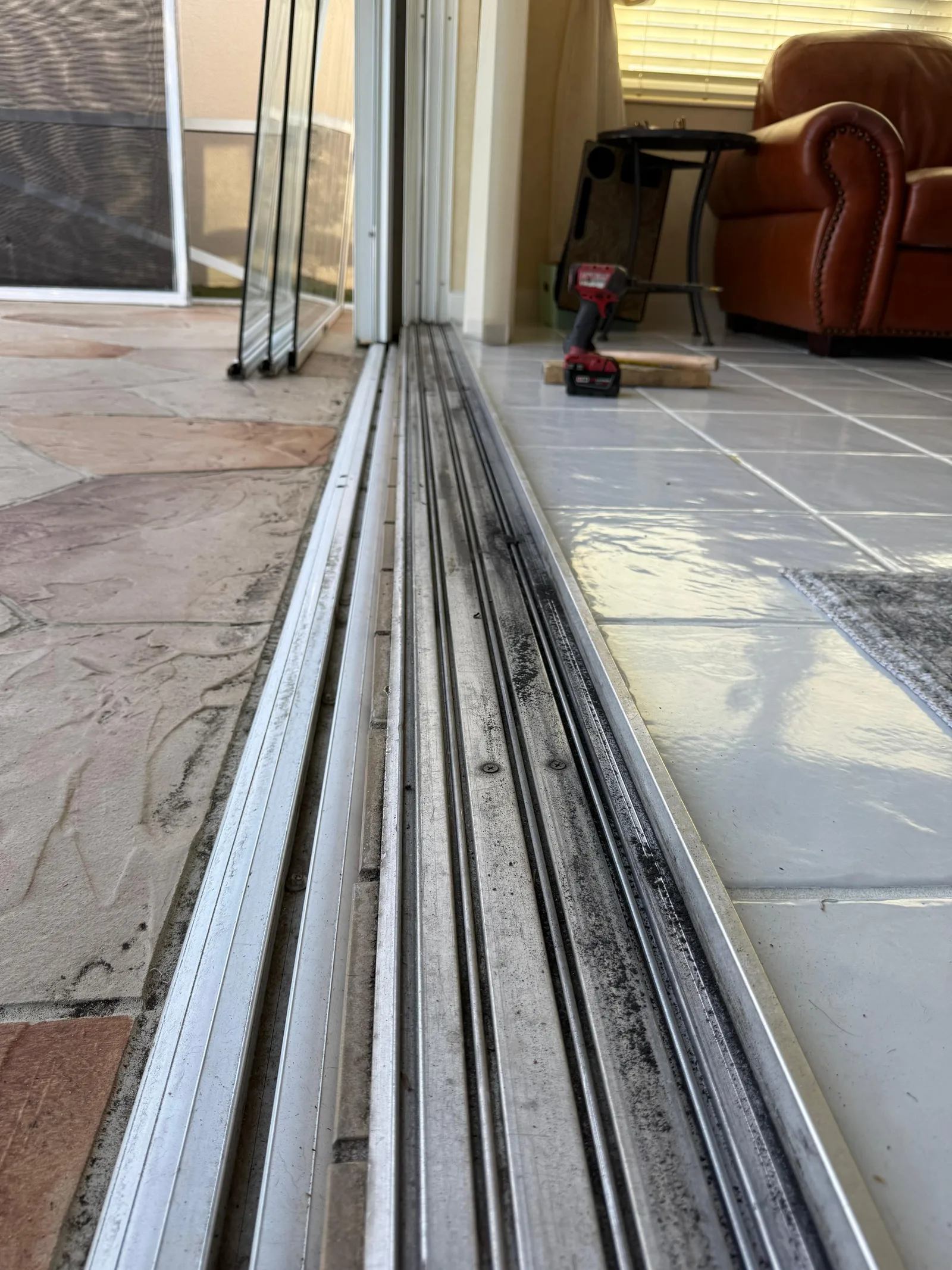 Cleaning a sliding door track during maintenance