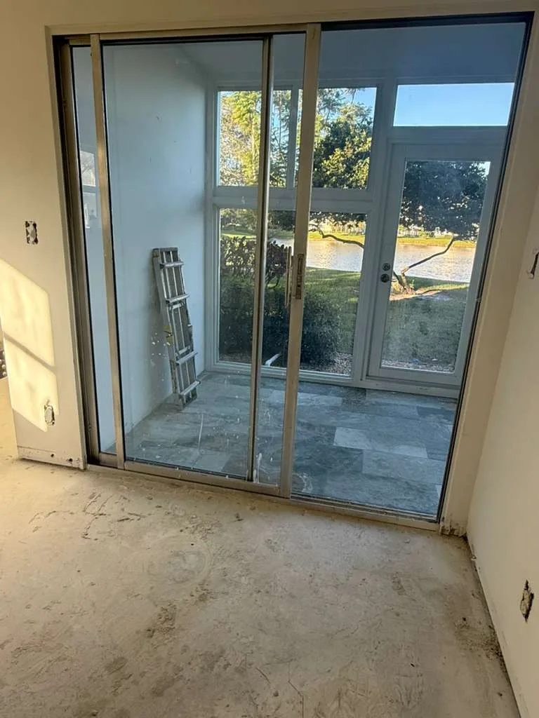 Patio sliding door in a townhouse before repair