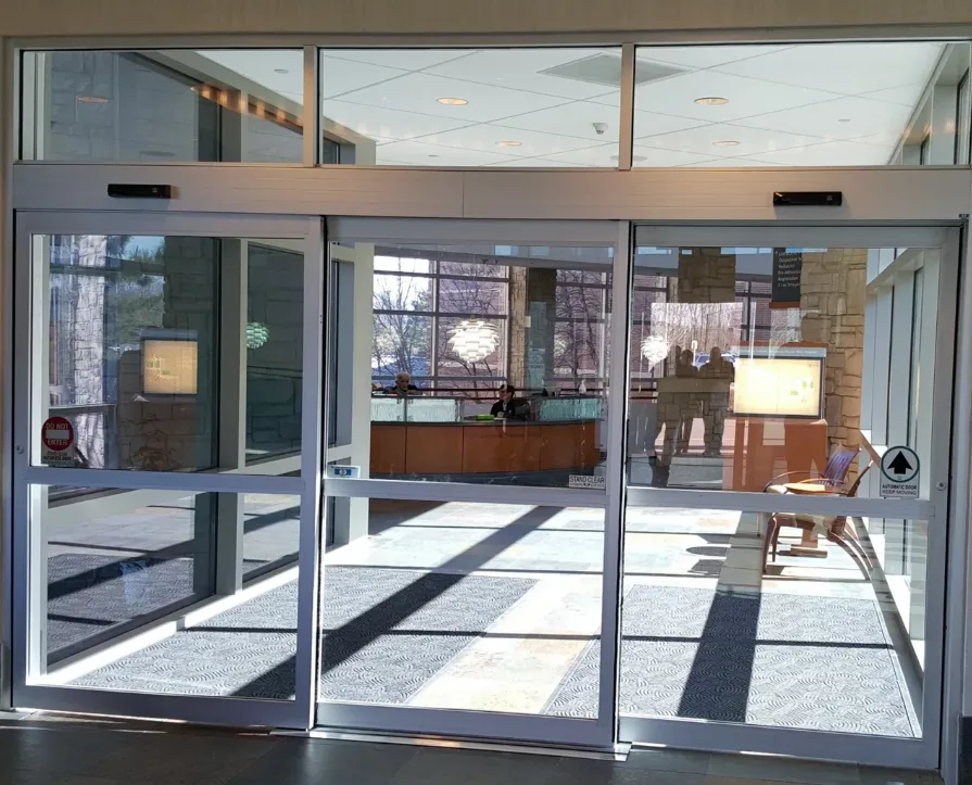 Worn automatic door rollers showing salt corrosion common along the Stuart waterfront