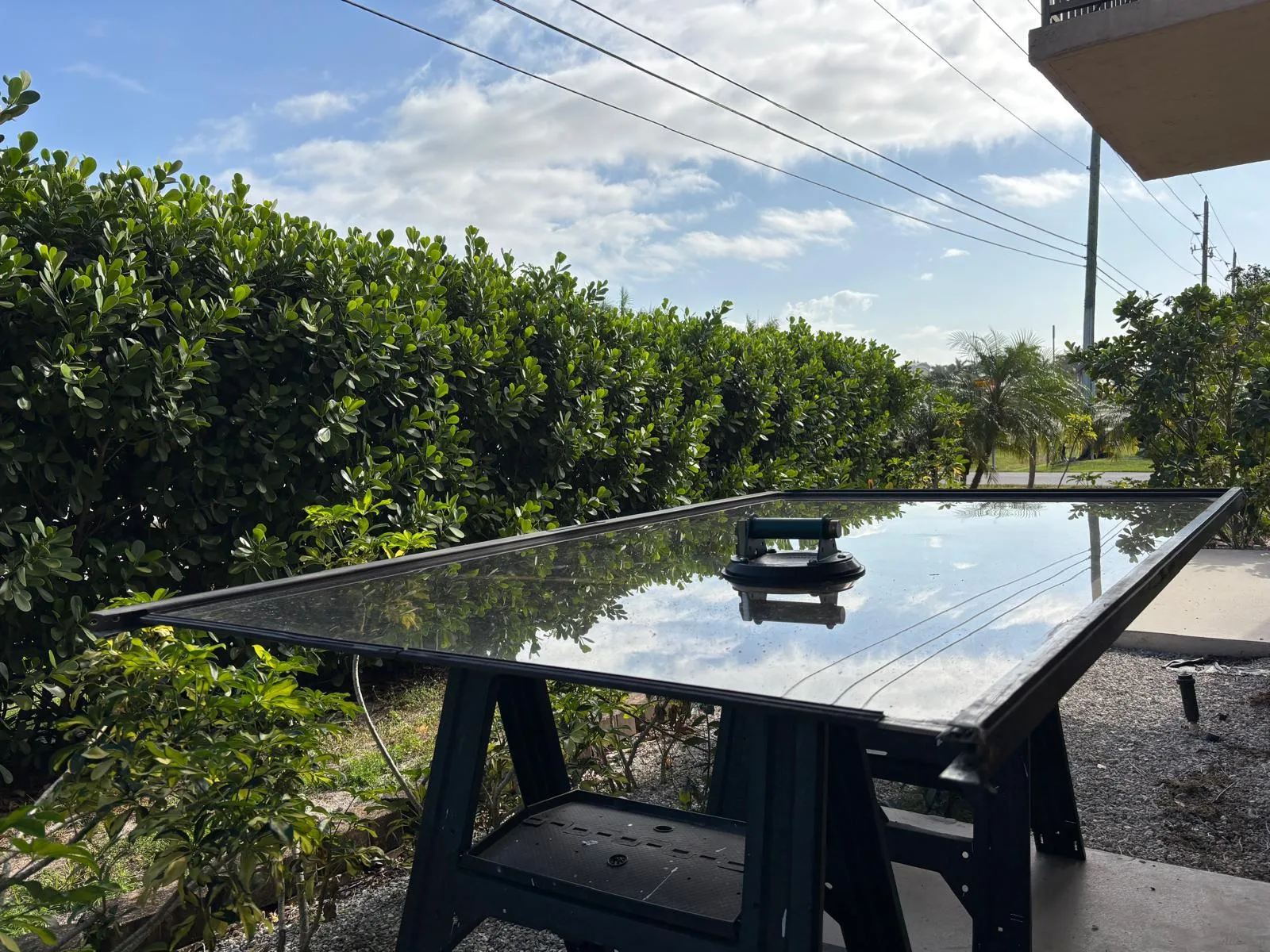 Technician working on sliding door panel to replace wheels
